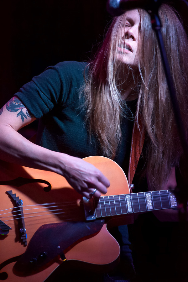 Color Photograph by Willa Stein of Sarah Shook playing guitar at fundraiser Willapalooza in downtown Raleigh, 2014