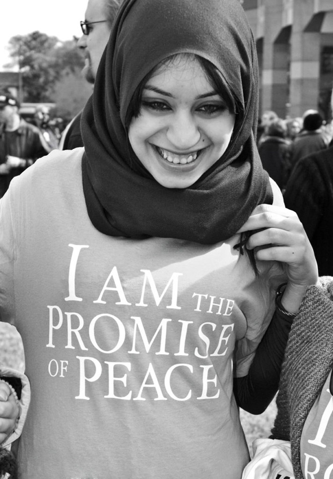 Woman in burka wearing a t-shirt that says, "I am the Promise of Peace" Photo by Willa Stein